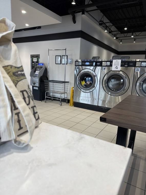 All Seasons Cleaners — attended drop-off laundry counter at 56 W Maple St in Near North Side, Chicago