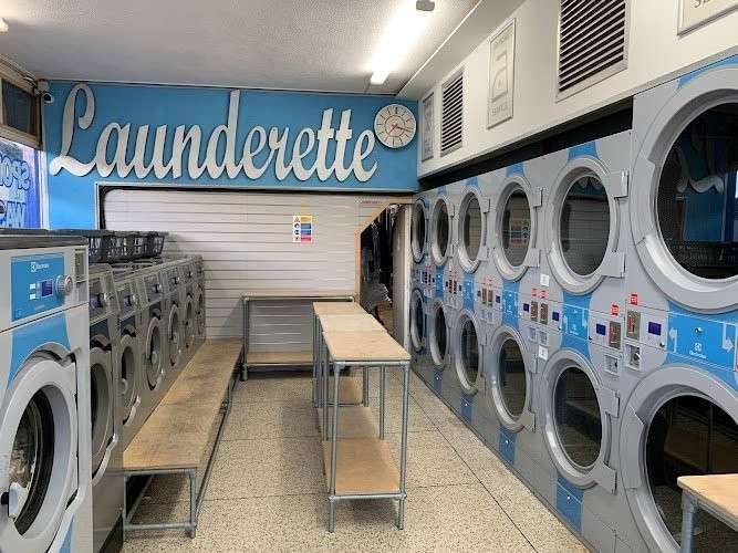 Coast Cleaners — attended drop-off laundry counter at 226 E Ontario St in Near North Side, Chicago